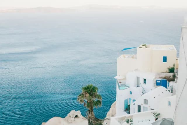 A Journey Through Ionian Beauty and Santorini Skies