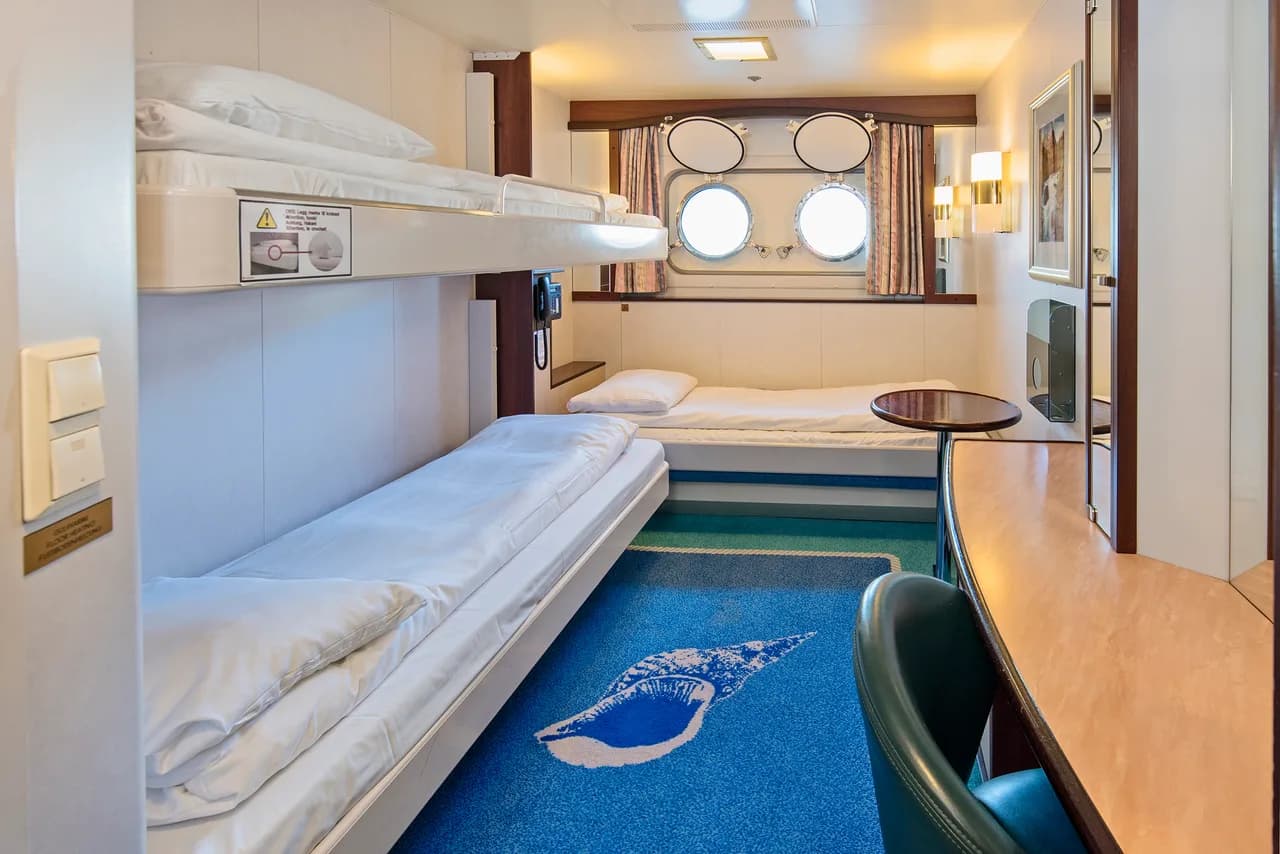 Triple on lower deck with porthole