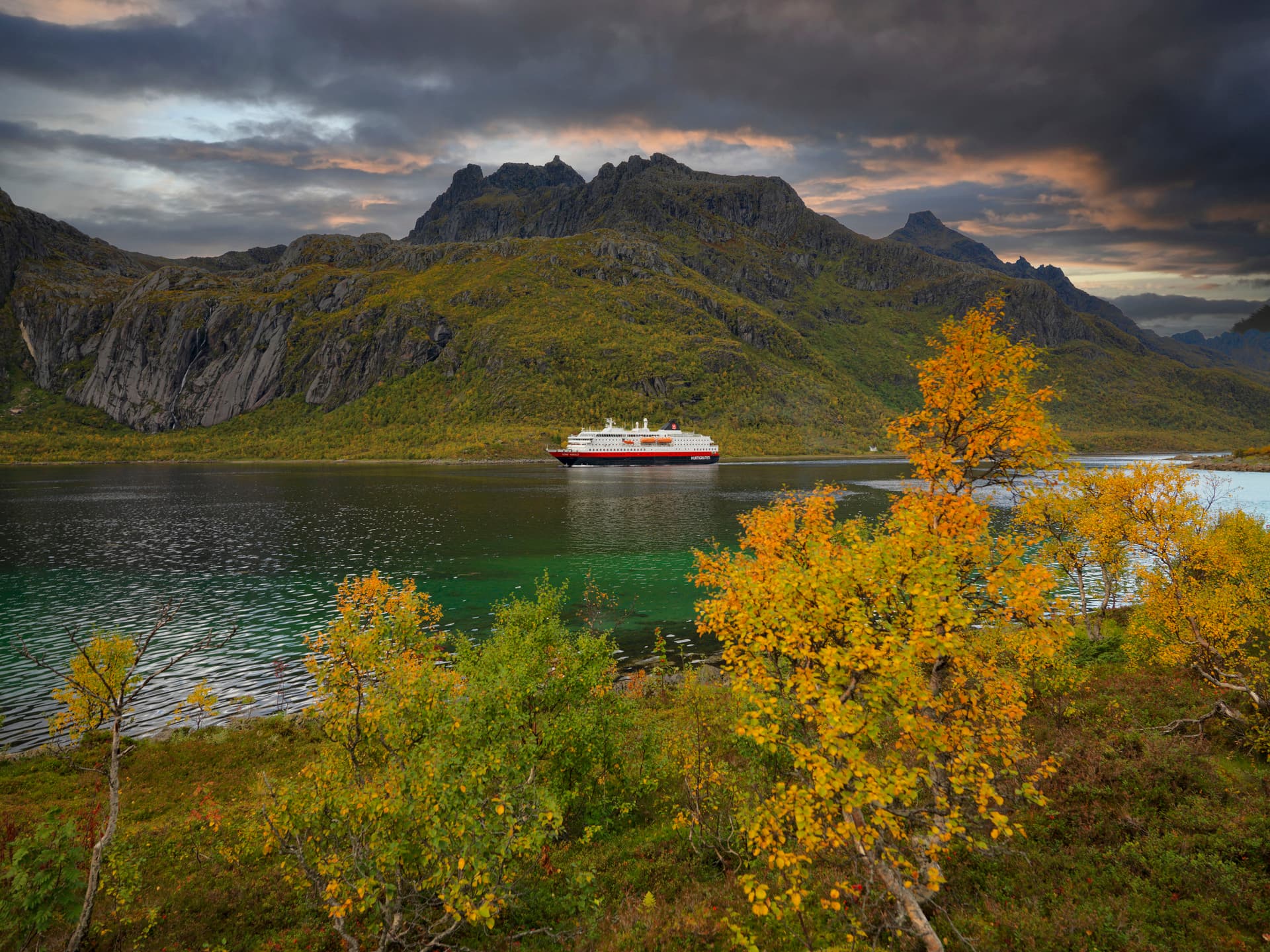 MS Kong Harald sailing through Trollfjord during autumn